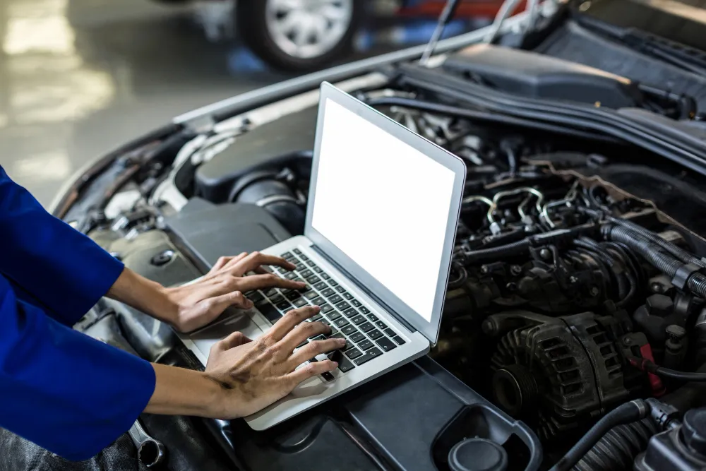 Technician conducting a fleet vehicle safety inspection in Dubai
