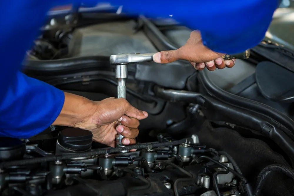 Technician performing mechanical repair on a fleet vehicle in Dubai